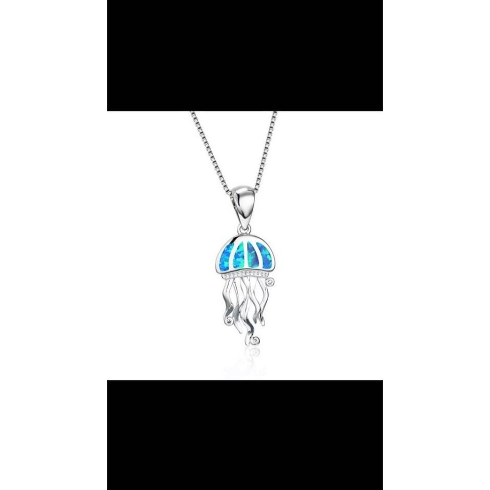 Fire Opal set in .925 Silver With Crystal